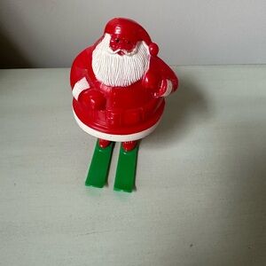 Vintage Rosbro plastic Santa Claus on green skis candy holder